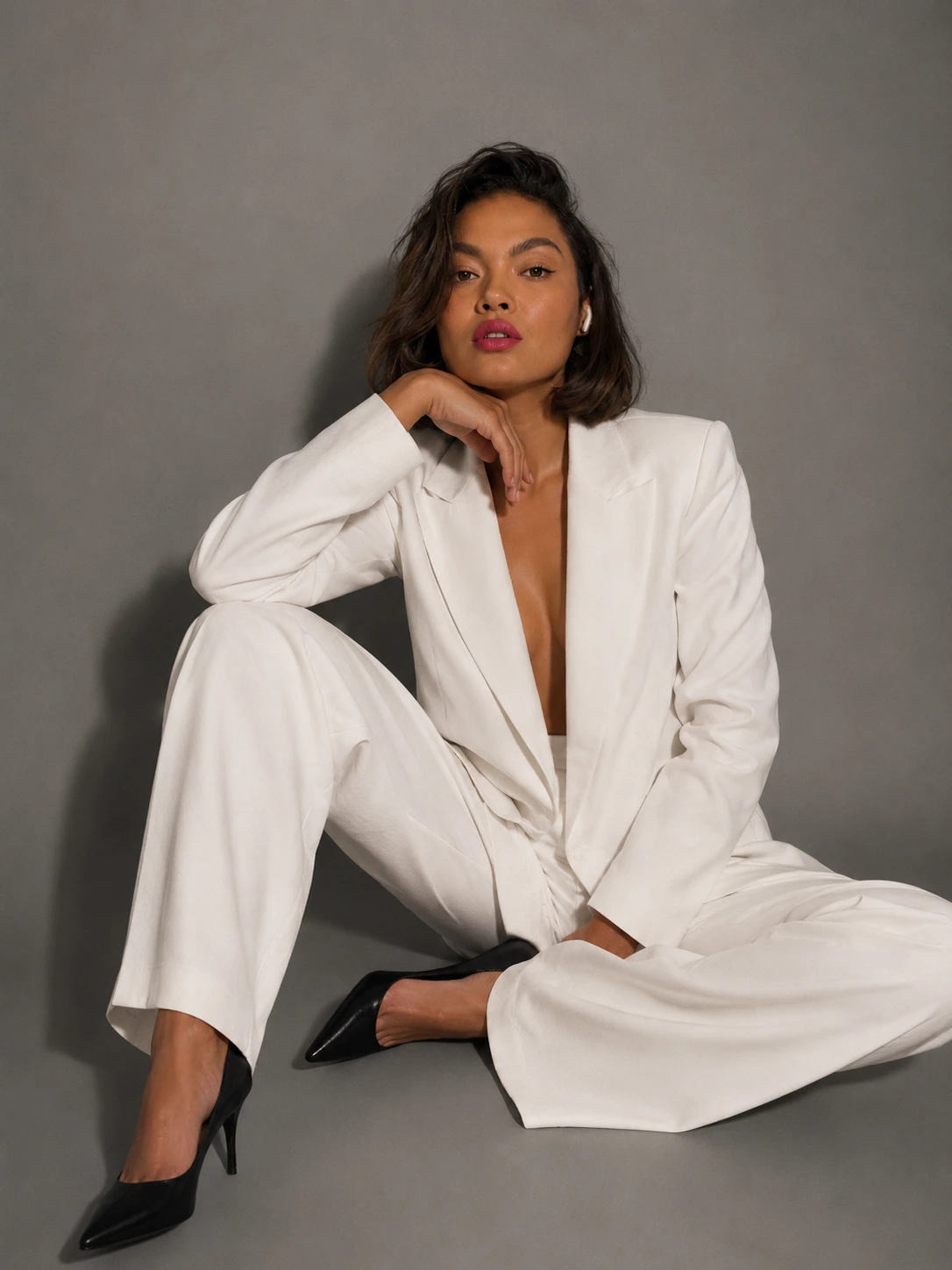 Anastacia Julie in a white suit